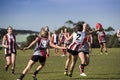 Young women play Australian Rules Football