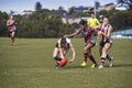 Young women play Australian Rules Football