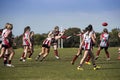 Young women play Australian Rules Football