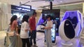 Shenzhen, China: young women play with virtual reality