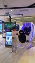 Shenzhen, China: young women play with virtual reality