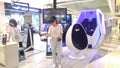 Shenzhen, China: young women play with virtual reality