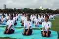 The young women are practicing yoga on first World yoga day in Kolkata.