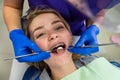 young woman with problem teeth came to the dentist to treat teeth.