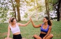 Young woman raise up hands and relax at public park in the morning together,Happy and smiling,Positive thinking,Healthy and lifest Royalty Free Stock Photo