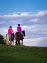 Two Young Women Riding Horses Royalty Free Stock Photo