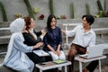 young woman is sad and comforted by friends while sitting together