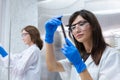 Young women scientist are working research and test chemical with test tubes in laboratory. student medical science experimenting Royalty Free Stock Photo