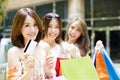 young Women showing Shopping Bags and credit card