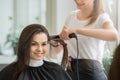 Young women sitting in beauty hair salon style