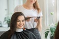 Young women sitting in beauty hair salon style