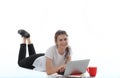 Young women is sitting on white background with laptop, cup, books and papers. Student girl studying, freelances is working.