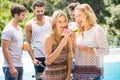 Young women smiling and having a slice of water melon Royalty Free Stock Photo