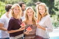 Young women smiling and having a slice of water melon Royalty Free Stock Photo