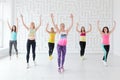 Young women in sportswear dancing at Zumba dance fitness class Royalty Free Stock Photo