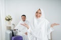 Young woman wearing white traditional clothes for Ihram ready for Hajj