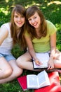 Young women studying outdoors