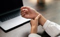 Young women suffer from wrist pain from typing in computers for a long time, May cause office syndrome.