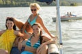 Young women sunbathing on boat