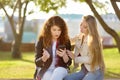 Young woman support and soothe her upsed friend. Two girl during the conversation Royalty Free Stock Photo