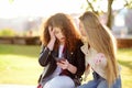 Young woman support and soothe her upsed friend. Two girl during the conversation