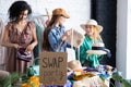 Young women at swap party. Zero waste shopping, reduce and reuse, donation