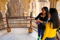 Young women taking selfie in Amber Fort, Rajasthan, India