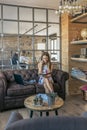 Woman talking on the cellphone working sitting on a sofa