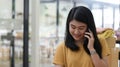 Young women talking on phone with a smiling expression Royalty Free Stock Photo