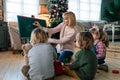 Education, kindergarten people concept. Young woman teacher with children playing together Royalty Free Stock Photo