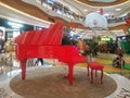 Shenzhen, China: Young women with their children play in a children`s play area in a large shopping mall