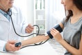 Young woman visiting doctor in hospital, closeup.