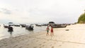 Young women walk on the beach