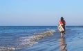 Young women wearing a black saree on the beach. Girl in traditional Indian sari among the rocks and enjoying the freedom. Royalty Free Stock Photo