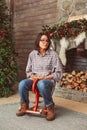 Surprised woman on wooden rocking horse Royalty Free Stock Photo