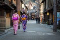 Young women wearing traditional japanese kimono walk on the street of Gion Royalty Free Stock Photo