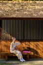 Young women wearing traditional Japanese kimono or yukata is happy and cheerful in the park Royalty Free Stock Photo