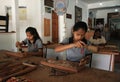 Young women wood carving