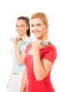 Young women working out with dumbbells Royalty Free Stock Photo
