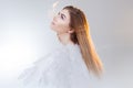 Young, wonderful blonde girl in the image of an angel with white wings. Royalty Free Stock Photo
