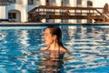 Wooman relaxing in swimming pool Royalty Free Stock Photo