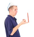 Young worker balancing pencil on his finger