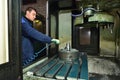 Stariy Oskol Russia - 18.01.2018: A young worker blows metal shavings from the chuck spindle with a stream of air from the