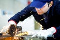 Young worker grinding a metal plate Royalty Free Stock Photo