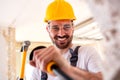 Young worker holding a hammer Royalty Free Stock Photo