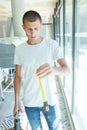 Young worker holding tape measurer at construction site