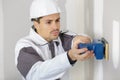 Young worker making repair in room Royalty Free Stock Photo