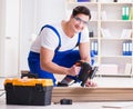 Young worker working on floor laminate tiles Royalty Free Stock Photo