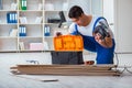 The young worker working on floor laminate tiles Royalty Free Stock Photo