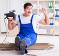 Young worker working on floor laminate tiles Royalty Free Stock Photo